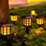 GIGALUMI 12-Pack Solar Flickering Flame Outdoor Garden Lights, Waterproof LED Pathway Lamps